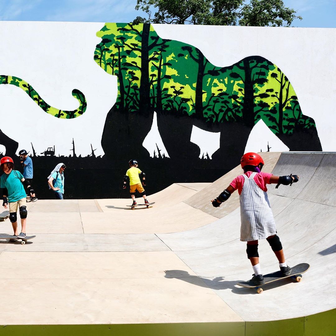 Some kids skating around in front of my #glastonbury #mural @greenpeaceuk 🔥 #flashback,Glastonbury Festival